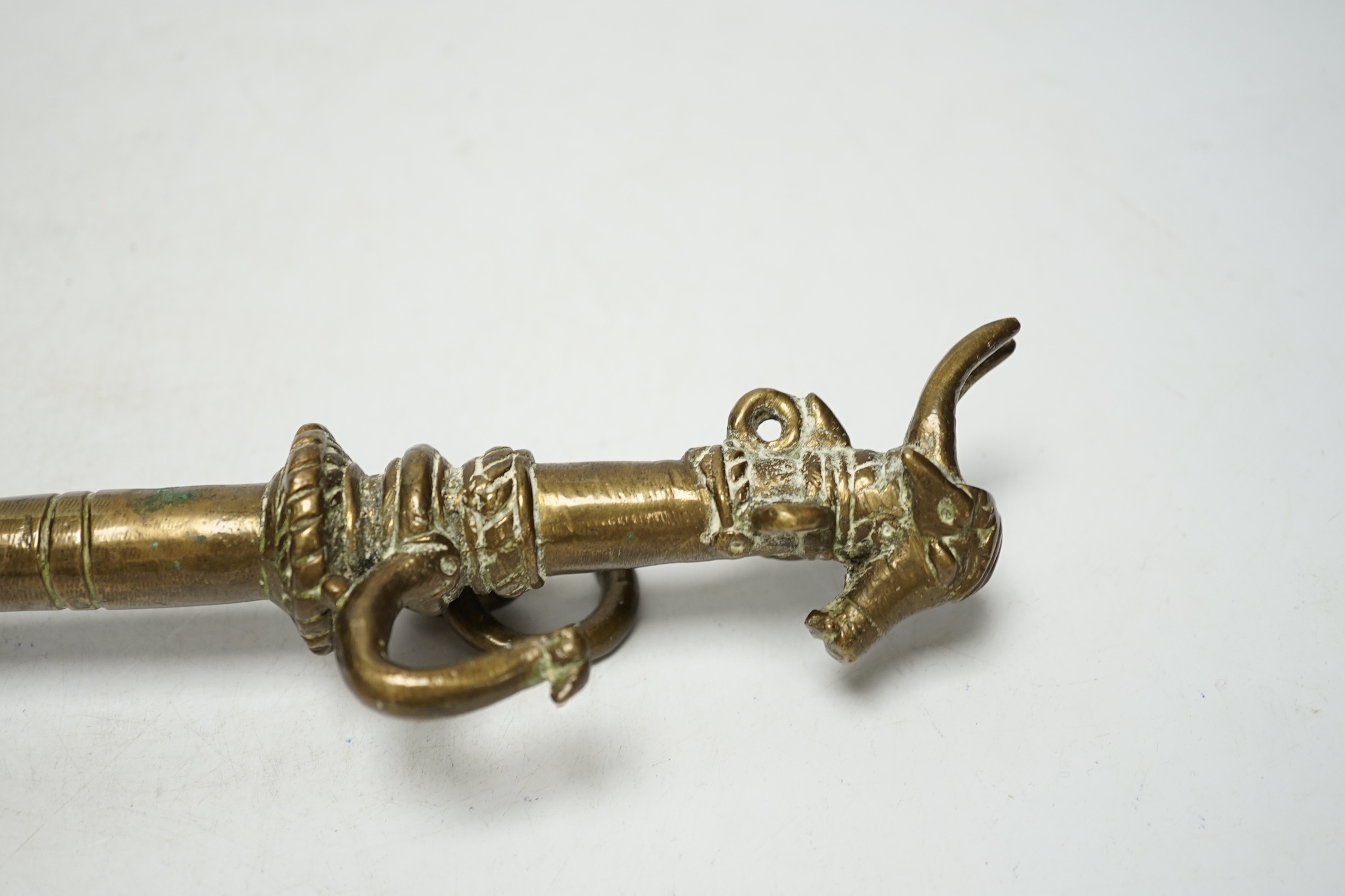A Tibetan bronze goat tether, 39cm high